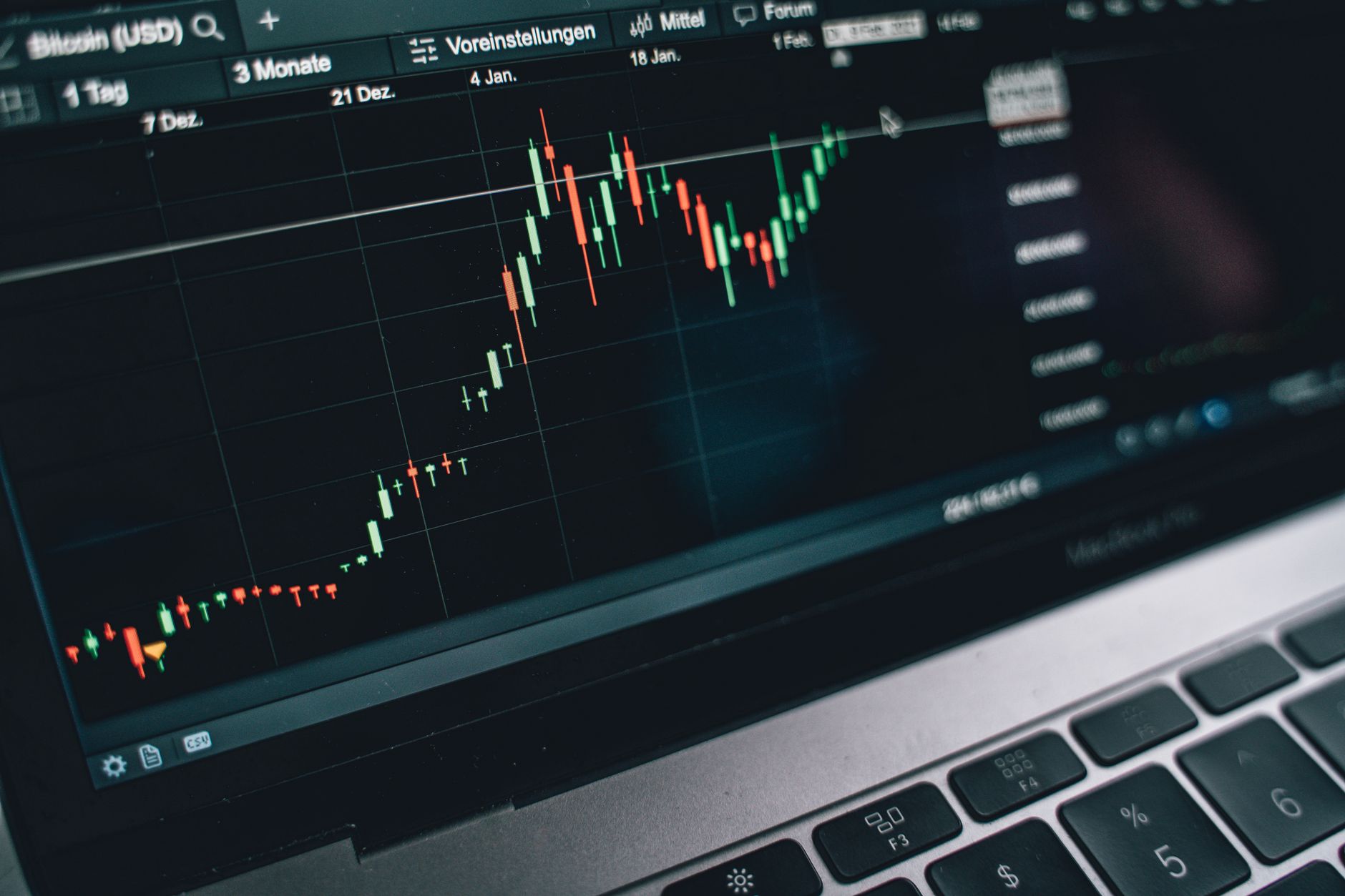Close-up of a computer screen displaying cryptocurrency market trends and data.